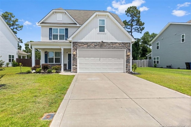 399 Springhaven Dr, Raeford, NC 28376 - craftsman house with stone siding, driveway, board and batten siding, and an attached garage