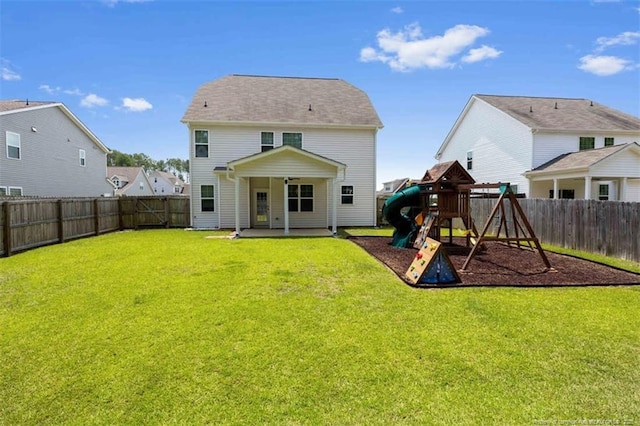 399 Springhaven Dr, Raeford, NC 28376 - rear view of property with a patio area, a fenced backyard, and a playground