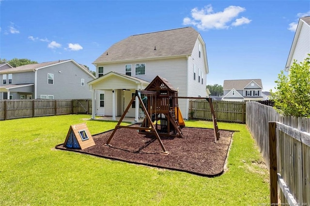 399 Springhaven Dr, Raeford, NC 28376 - back of house featuring a playground and a fenced backyard