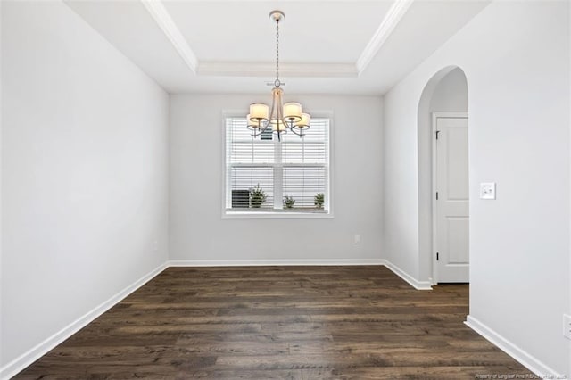 399 Springhaven Dr, Raeford, NC 28376 - unfurnished room with a raised ceiling, ornamental molding, a chandelier, dark wood finished floors, and arched walkways