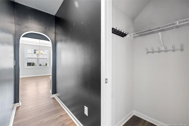 399 Springhaven Dr, Raeford, NC 28376 - hall featuring a chandelier and wood finished floors