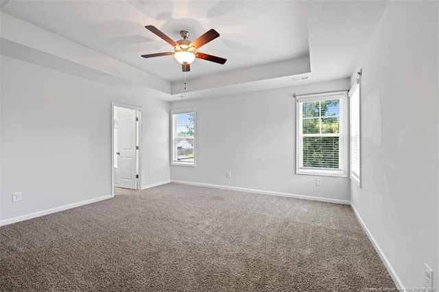 399 Springhaven Dr, Raeford, NC 28376 - spare room with a raised ceiling, carpet floors, and a ceiling fan