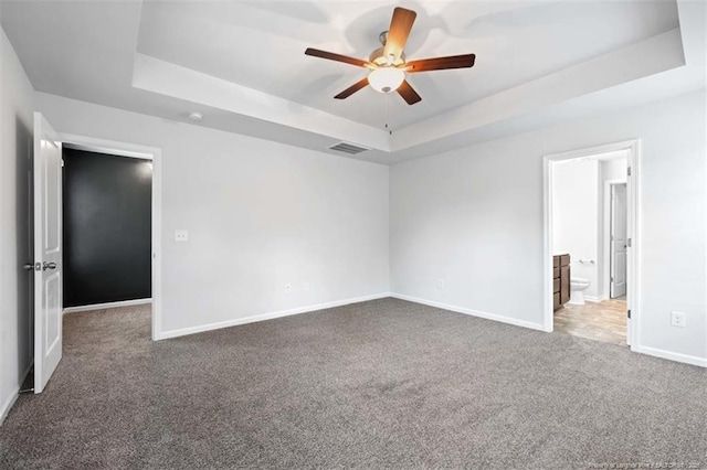 399 Springhaven Dr, Raeford, NC 28376 - carpeted empty room with a tray ceiling and a ceiling fan