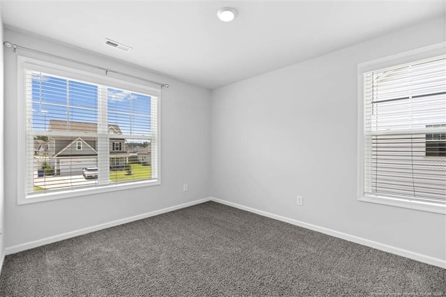 399 Springhaven Dr, Raeford, NC 28376 - empty room featuring dark colored carpet and baseboards