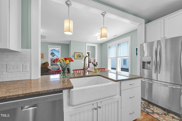322 Tobacco Farm Way, Chapel Hill, NC 27516 - kitchen featuring stainless steel appliances, white cabinetry, and plenty of natural light