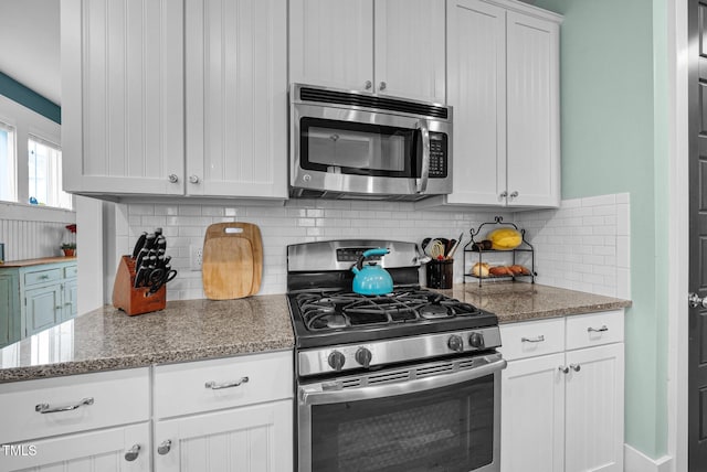 322 Tobacco Farm Way, Chapel Hill, NC 27516 - kitchen with stainless steel appliances, decorative backsplash, white cabinetry, and light stone countertops