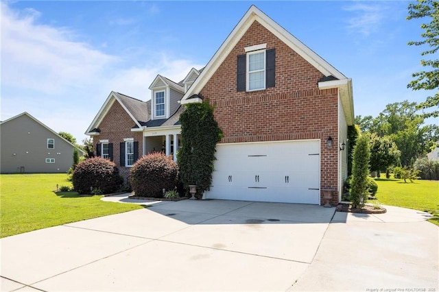 115 Race Ct, Godwin, NC 28344 - traditional-style house featuring brick siding, a garage, driveway, and a front lawn