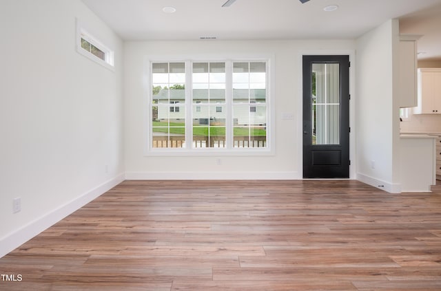 205 Gentry St, Roxboro, NC 27573 - foyer featuring light wood-style flooring and baseboards