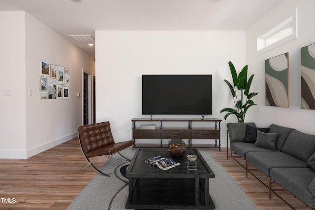 205 Gentry St, Roxboro, NC 27573 - living room featuring wood finished floors and recessed lighting