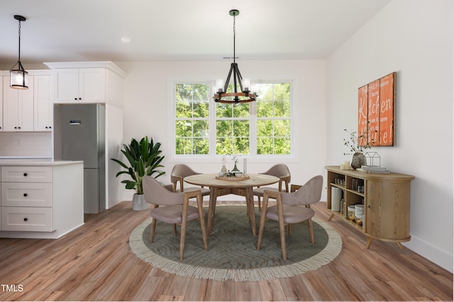 205 Gentry St, Roxboro, NC 27573 - dining room with light wood finished floors and recessed lighting