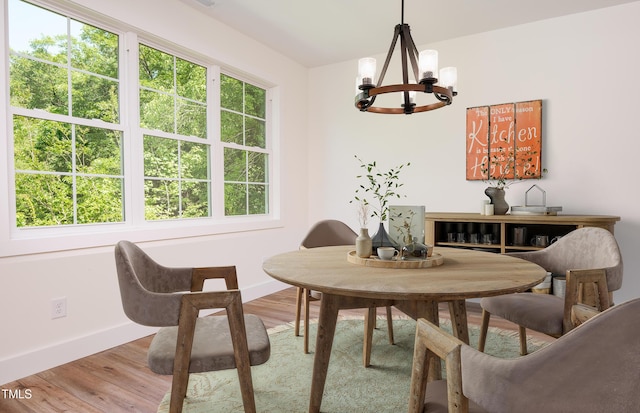 205 Gentry St, Roxboro, NC 27573 - dining space with a chandelier and wood finished floors
