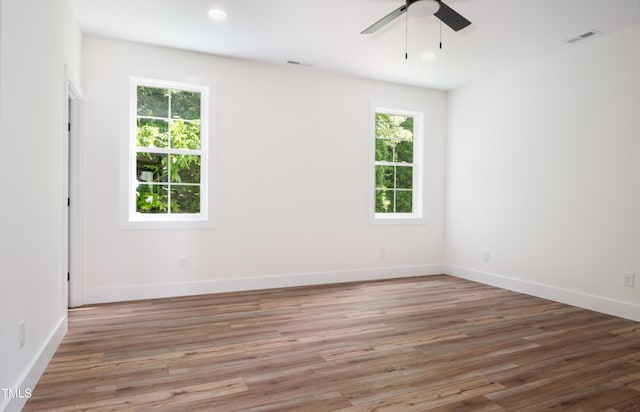 205 Gentry St, Roxboro, NC 27573 - empty room with a ceiling fan, light wood finished floors, and recessed lighting
