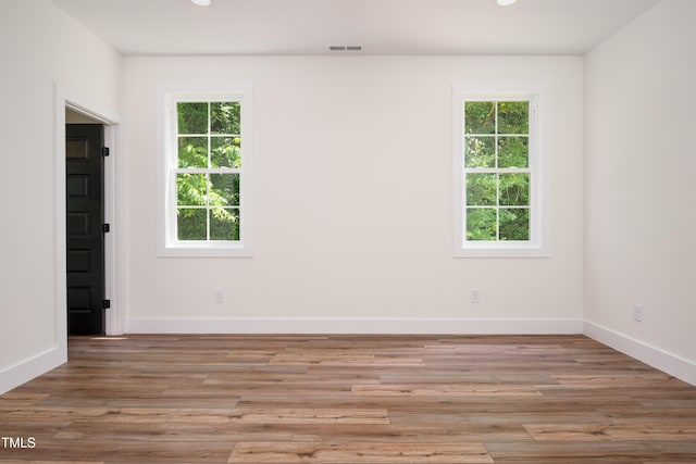 205 Gentry St, Roxboro, NC 27573 - unfurnished room with healthy amount of natural light, light wood-style floors, and recessed lighting
