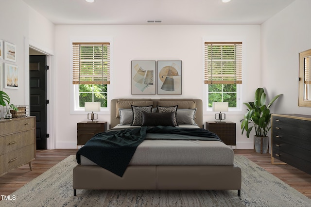 205 Gentry St, Roxboro, NC 27573 - bedroom featuring multiple windows, wood finished floors, and recessed lighting