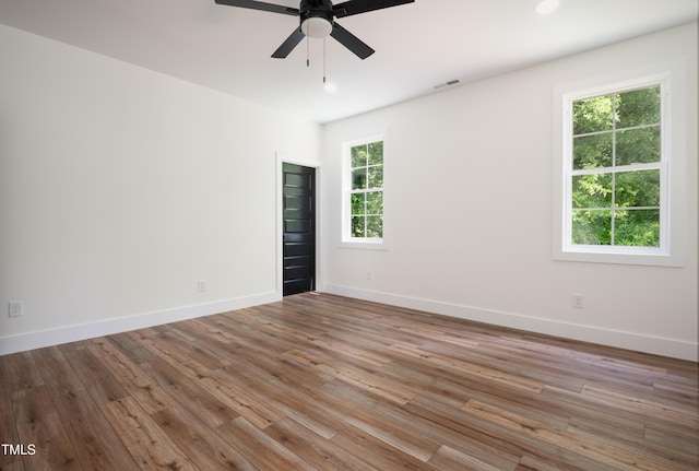 205 Gentry St, Roxboro, NC 27573 - empty room featuring ceiling fan, wood finished floors, and recessed lighting