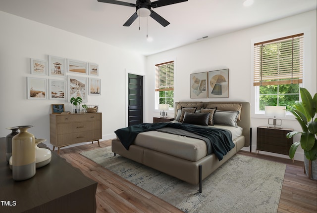 205 Gentry St, Roxboro, NC 27573 - bedroom with wood finished floors, ceiling fan, and recessed lighting