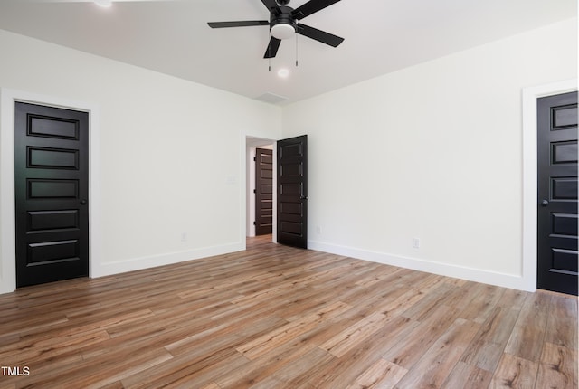 205 Gentry St, Roxboro, NC 27573 - spare room with a ceiling fan and light wood-style floors