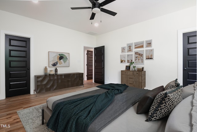 205 Gentry St, Roxboro, NC 27573 - bedroom featuring wood finished floors and ceiling fan