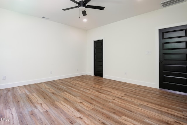 205 Gentry St, Roxboro, NC 27573 - unfurnished room featuring ceiling fan and light wood-style flooring