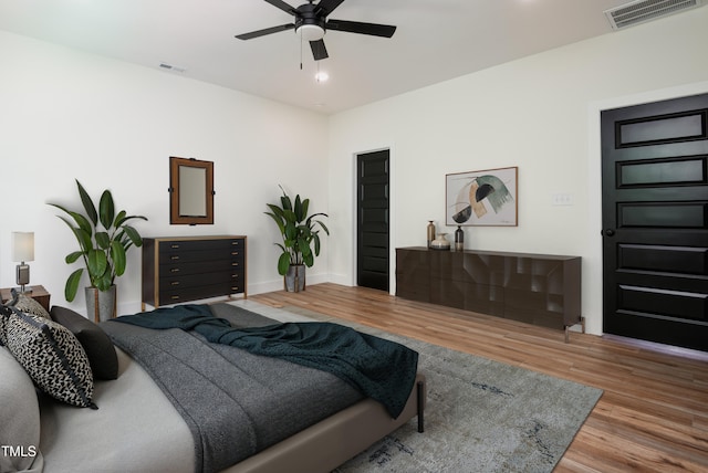205 Gentry St, Roxboro, NC 27573 - bedroom with wood finished floors and ceiling fan