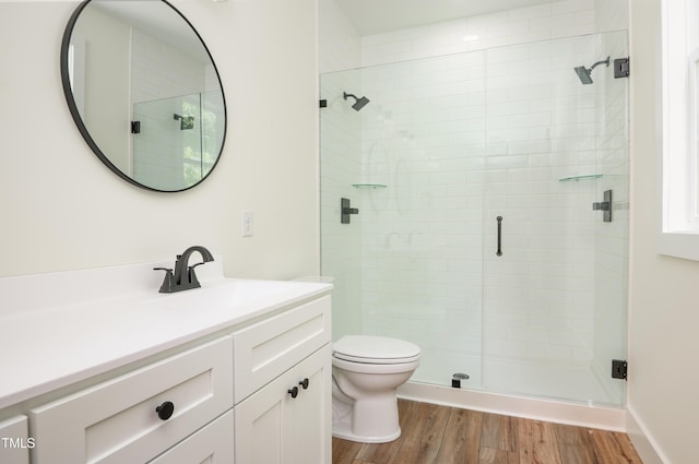 205 Gentry St, Roxboro, NC 27573 - full bath with vanity, a shower stall, and wood finished floors