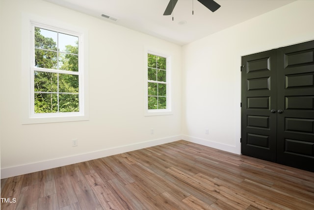 205 Gentry St, Roxboro, NC 27573 - spare room with ceiling fan and wood finished floors