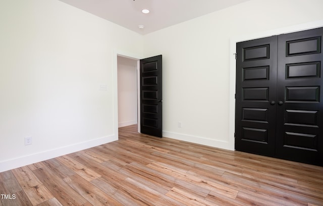 205 Gentry St, Roxboro, NC 27573 - unfurnished room featuring baseboards and light wood-type flooring