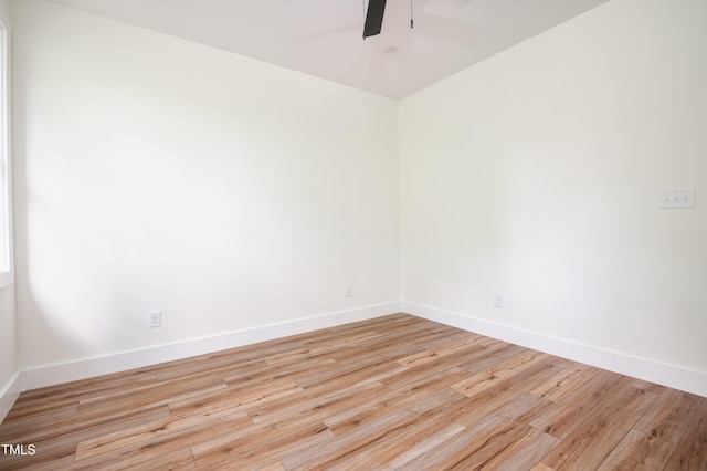 205 Gentry St, Roxboro, NC 27573 - empty room with ceiling fan and light wood-type flooring
