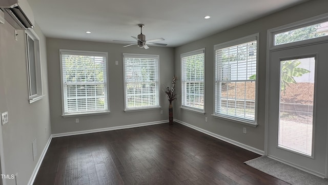 205 Bog Hill Ln, Cary, NC 27519 - unfurnished dining area with a wall mounted AC, a ceiling fan, dark wood-style floors, plenty of natural light, and recessed lighting
