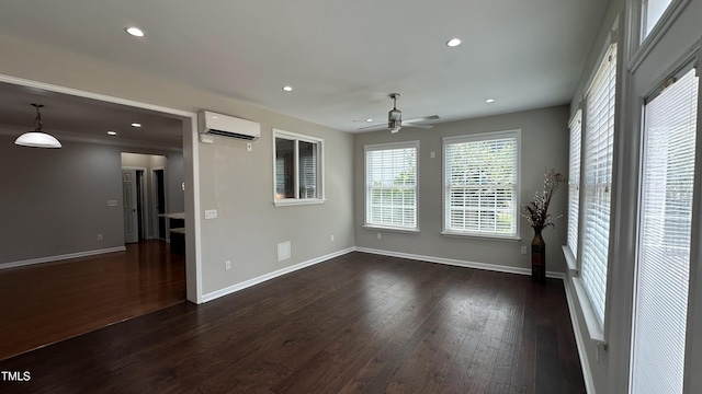 205 Bog Hill Ln, Cary, NC 27519 - empty room with an AC wall unit, a ceiling fan, recessed lighting, and dark wood-style flooring