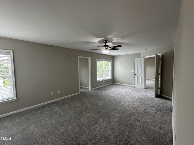 205 Bog Hill Ln, Cary, NC 27519 - spare room featuring a ceiling fan and dark colored carpet