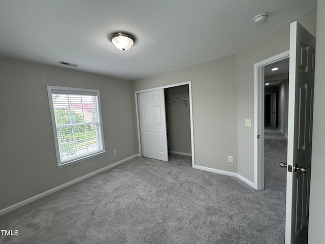 205 Bog Hill Ln, Cary, NC 27519 - unfurnished bedroom featuring carpet and a closet