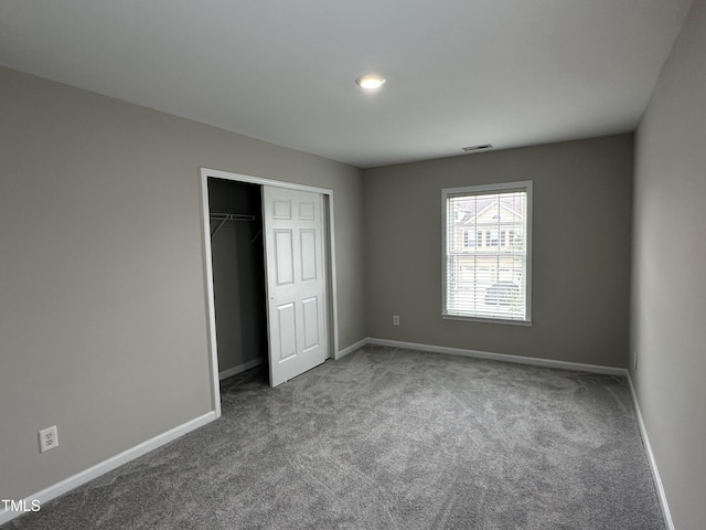 205 Bog Hill Ln, Cary, NC 27519 - unfurnished bedroom featuring carpet floors and a closet