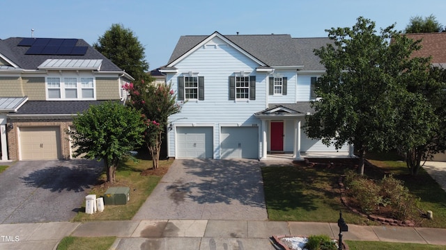 205 Bog Hill Ln, Cary, NC 27519 - traditional home with decorative driveway, a garage, and roof with shingles