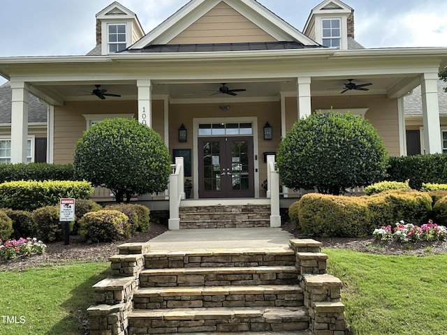 205 Bog Hill Ln, Cary, NC 27519 - property entrance with ceiling fan, french doors, a lawn, and a porch