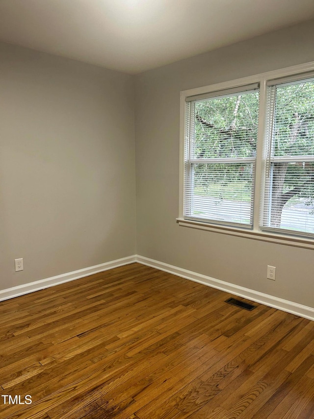 2331 Kennington Rd, Raleigh, NC 27610 - unfurnished room with dark wood-style flooring and baseboards