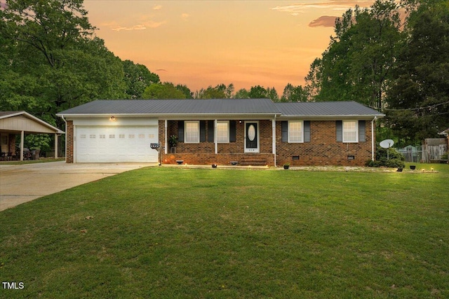 410 W Tenth St, Siler City, NC 27344 - ranch-style home featuring crawl space, a lawn, an attached garage, driveway, and a metal roof