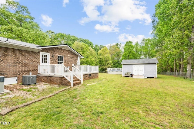 410 W Tenth St, Siler City, NC 27344 - view of yard featuring a wooden deck, a storage shed, and view of scattered trees