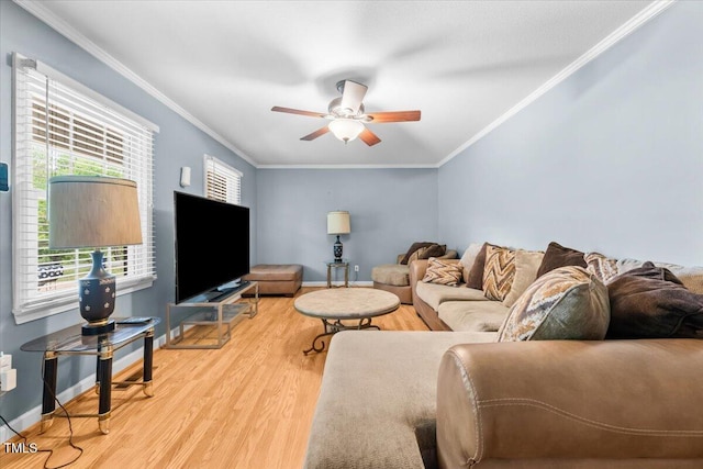 410 W Tenth St, Siler City, NC 27344 - living area with light wood finished floors, healthy amount of natural light, ceiling fan, and ornamental molding