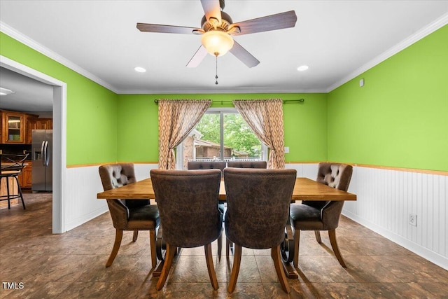 410 W Tenth St, Siler City, NC 27344 - dining space with a wainscoted wall, ornamental molding, a ceiling fan, stone finish floors, and recessed lighting