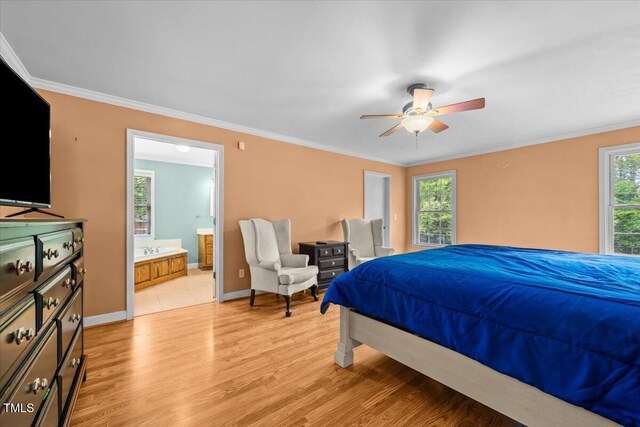 410 W Tenth St, Siler City, NC 27344 - bedroom featuring crown molding, light wood finished floors, ensuite bathroom, and ceiling fan