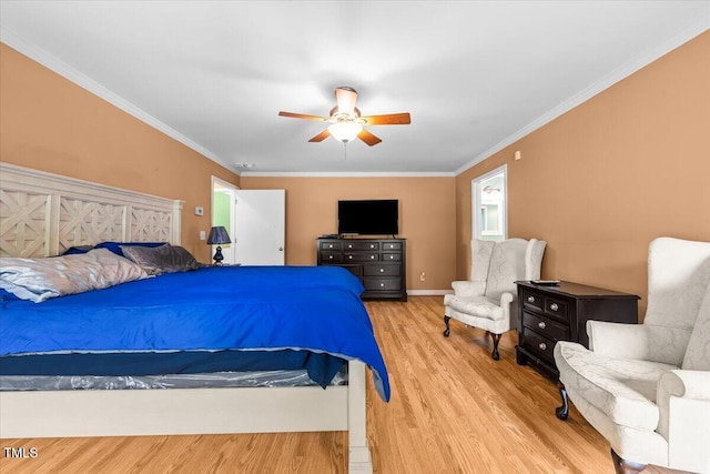 410 W Tenth St, Siler City, NC 27344 - bedroom with wood finished floors, ceiling fan, and ornamental molding