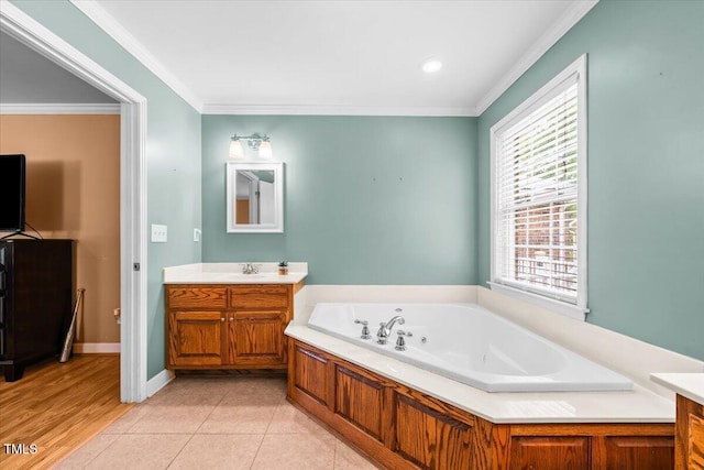 410 W Tenth St, Siler City, NC 27344 - full bath featuring vanity, a tub with jets, and ornamental molding