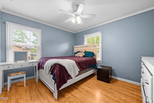 410 W Tenth St, Siler City, NC 27344 - bedroom with light wood-type flooring, ornamental molding, and ceiling fan