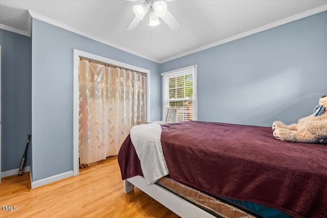 410 W Tenth St, Siler City, NC 27344 - bedroom with wood finished floors, ornamental molding, and ceiling fan