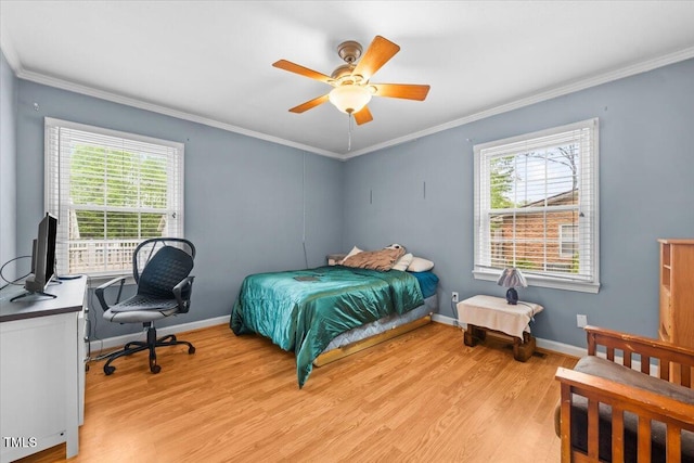 410 W Tenth St, Siler City, NC 27344 - bedroom with light wood-style flooring, crown molding, a desk, and a ceiling fan
