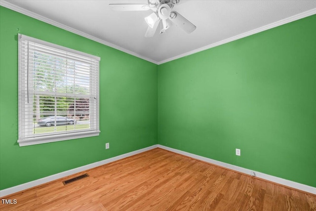 410 W Tenth St, Siler City, NC 27344 - spare room featuring wood finished floors, crown molding, and ceiling fan