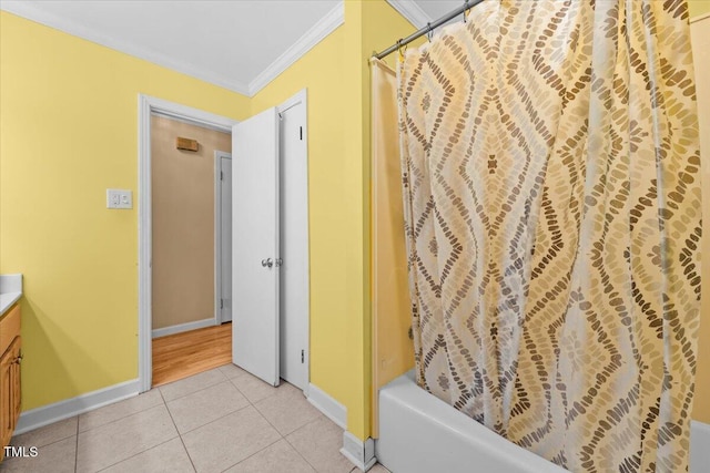 410 W Tenth St, Siler City, NC 27344 - bathroom featuring ornamental molding, vanity, tile patterned floors, and shower / bath combo