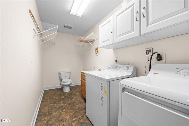 410 W Tenth St, Siler City, NC 27344 - laundry area with washing machine and clothes dryer and stone finish flooring