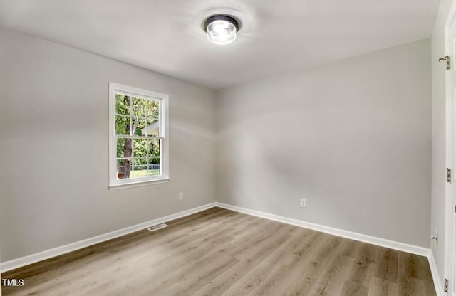117 S Woodstone Dr, Archer Lodge, NC 27527 - spare room featuring baseboards and wood finished floors